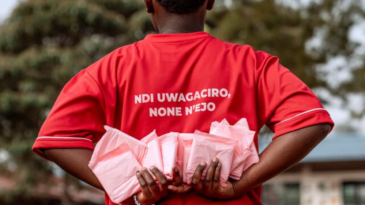 A girl holding period pads