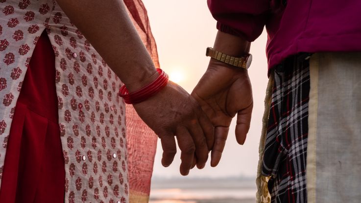 Holding hands by the river