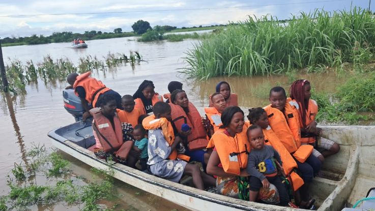 people being rescued on a boat