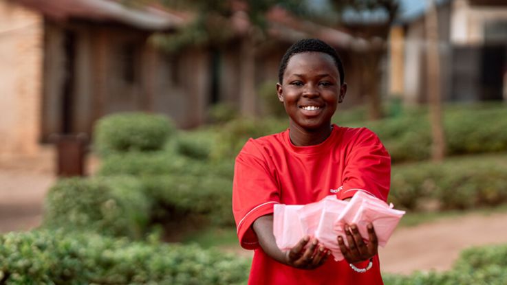 Girl holding up period pads