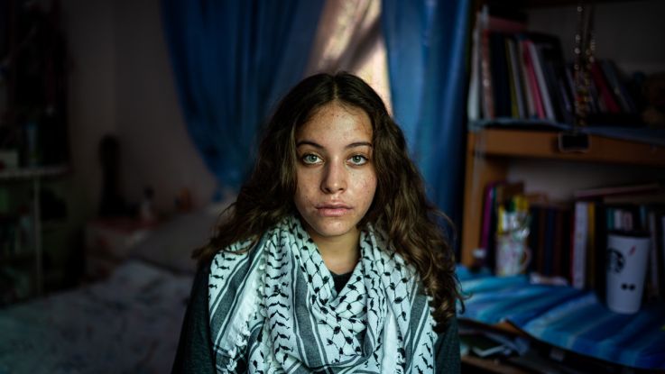 A young girl looking into camera