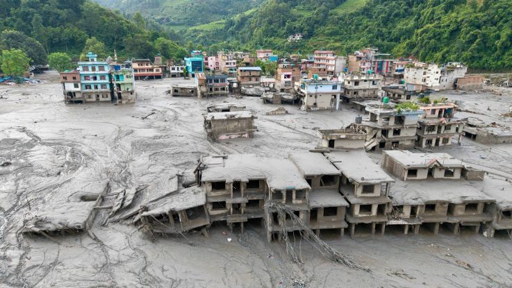 Aerial view showing residential buildings affected by the flash floods and landslide in Devighat, Bidur Municipality in Nepal's Nuwakot district.