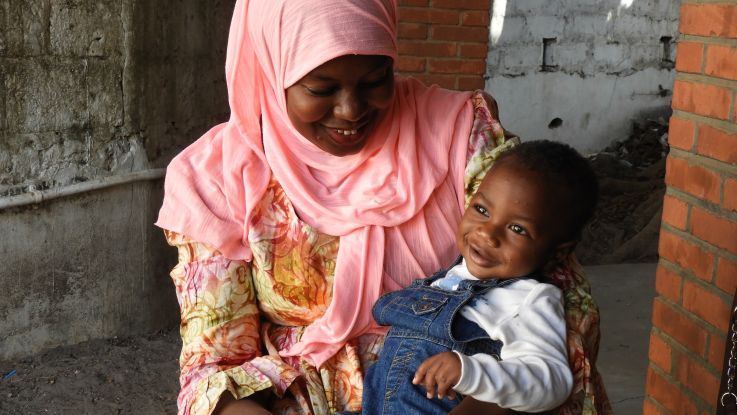 Haddy and her son Mohamed, from western Gambia. Mohamed has received life-saving vaccines thanks to one of ActionAid’s healthcare projects