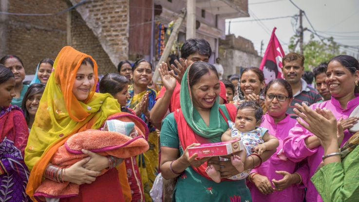 Mothers with their new born daughters at Beti Utsav celebration at Bhalswa, New Delhi