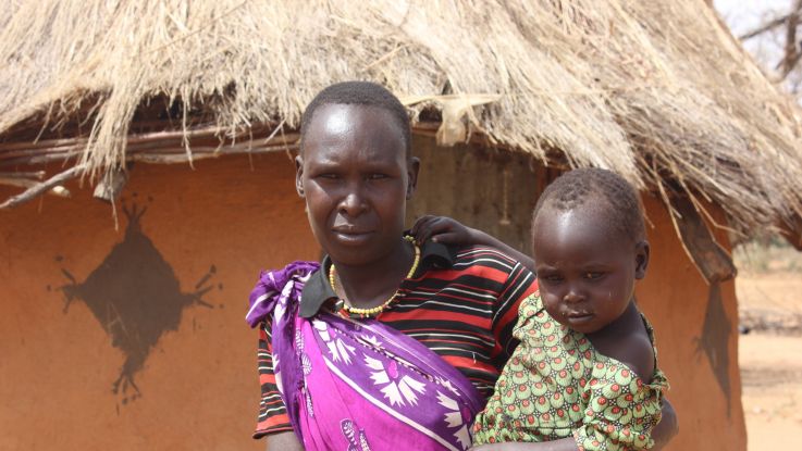 Chepochemuna Raphael holds her daughter. She is fearful about the lack of food in her community. 